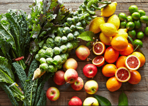 a group of fruits and vegetables on a wood surface Healthy Weight Loss Diets East Kilbride