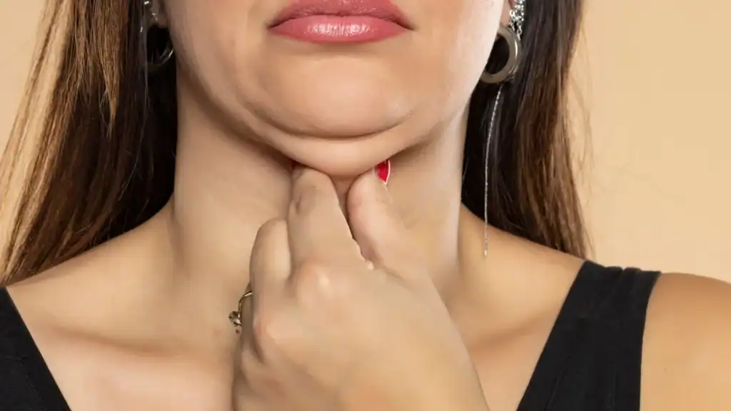 An image of a woman with double chin, sad, worried : Non Surgical Double Chin Removal Treatment in East Kilbride, UK